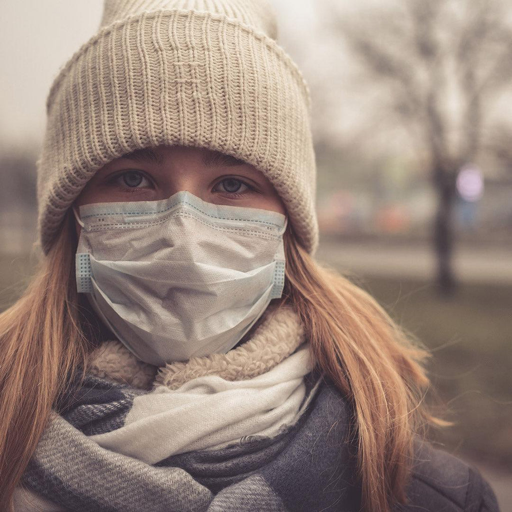 Woman Runner Wearing Mask to protect against Coronavirus